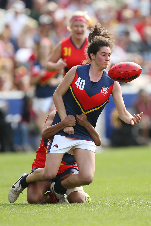 AFL 2016 Media - SANFL All Stars Womens Match MELBOURNE, AUSTRALIA - APRIL 2: Rachael Killian of SA Blue is tackled by Bronwyn Davey of SA Red during the SANFL All Stars Womens match at Adelaide Oval in Adelaide, Australia on April 2, 2016. (Photo by James Elsby/AFL Media)